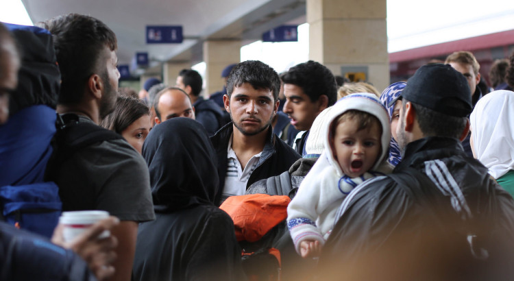 Syrian refugees waiting for a train