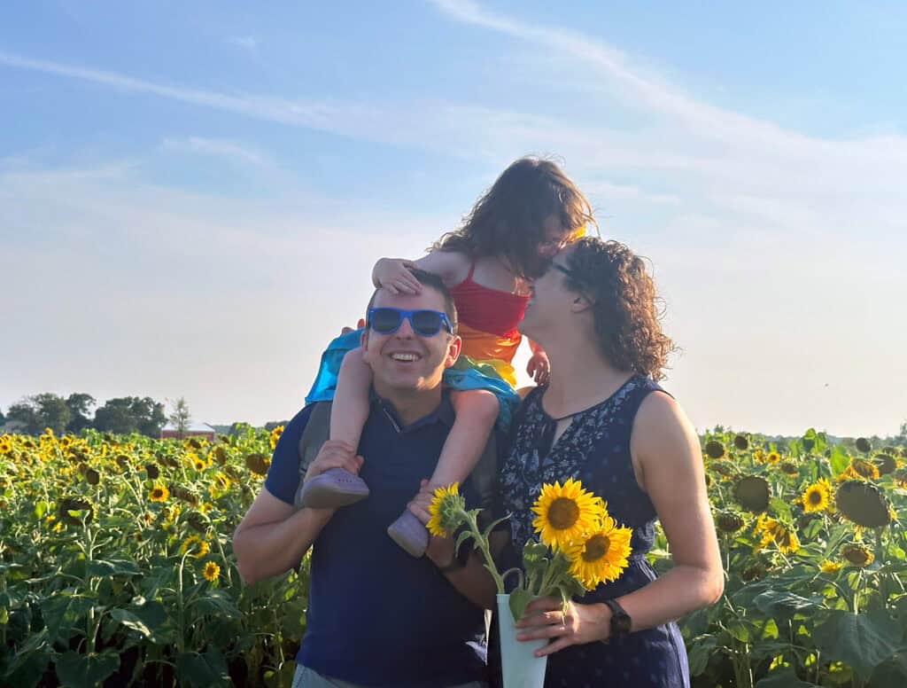 Kyle, Kristin, Fiona being goofy at a sunflower farm